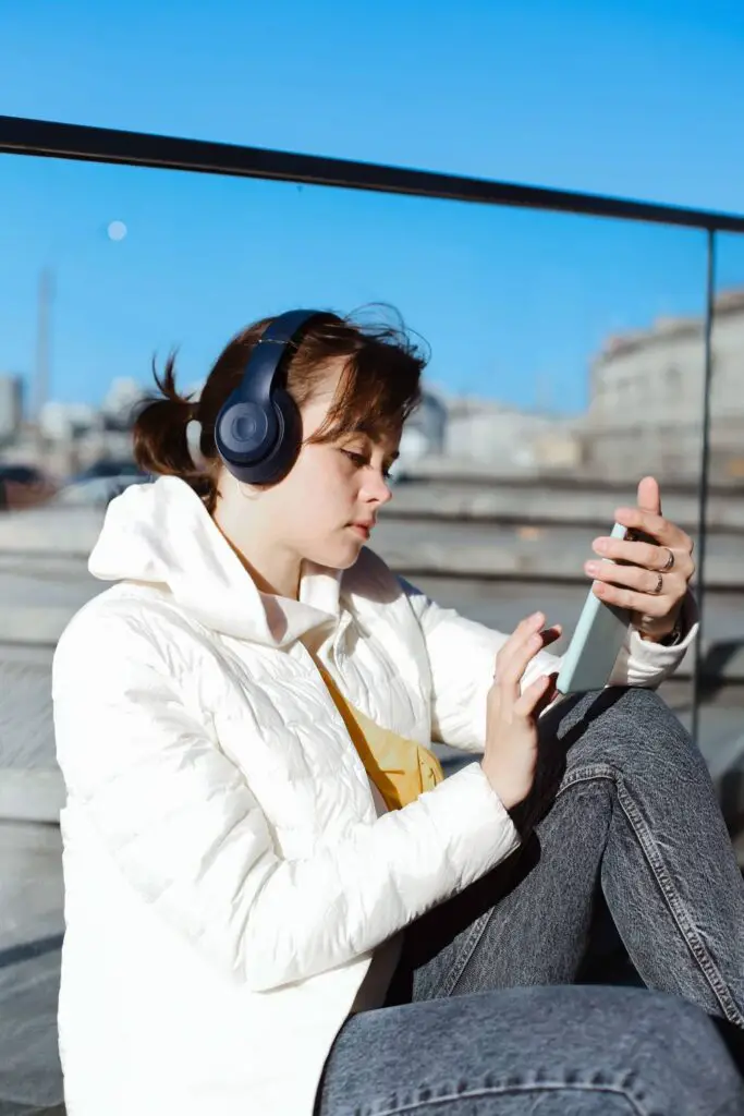 Woman wearing over-ear headphones