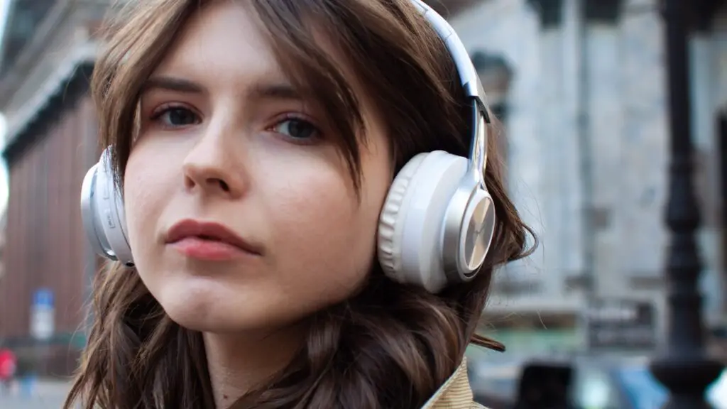 women wearing on-ear headphones 
