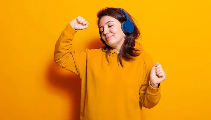 An image of a person dancing wearing headphones