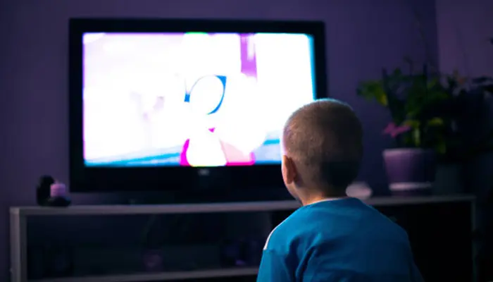 kid watching cartoon on Hisense TV