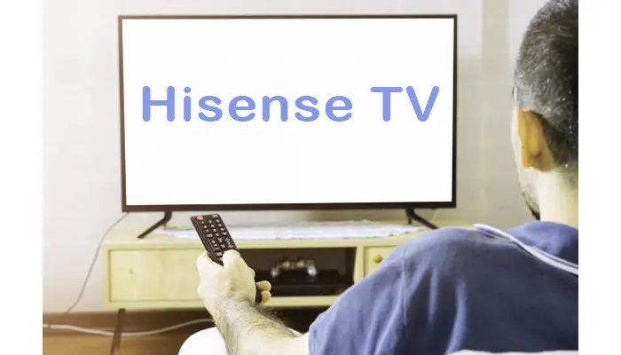 person starting Hisense TV with remote